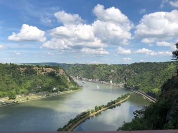 High angle view of river amidst trees against sky