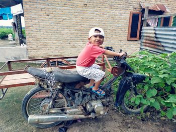 Portrait of senior man riding bicycle