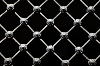 Decorative wrought iron grid, isolated on black