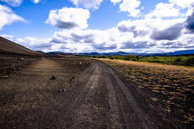 Road through the lava meadows on lake myvatn near husavik in iceland