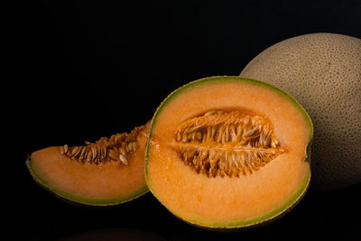 Close-up of lemon slice against black background