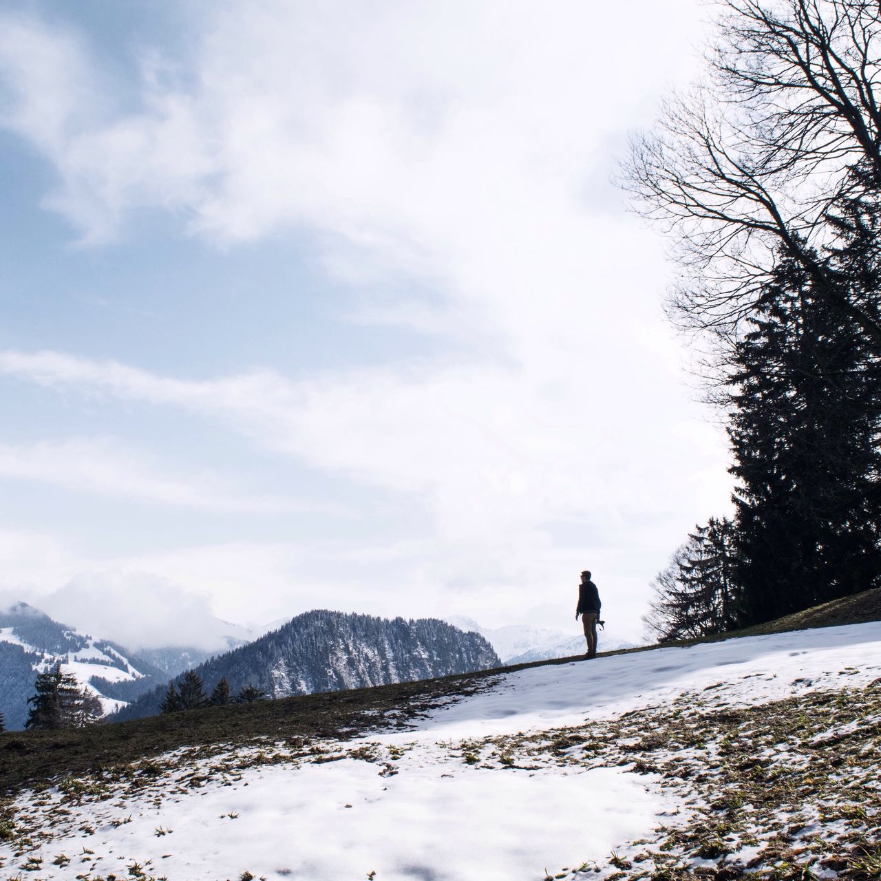 snow, winter, cold temperature, season, weather, mountain, tranquil scene, leisure activity, sky, tranquility, lifestyles, rear view, full length, nature, men, beauty in nature, walking, scenics