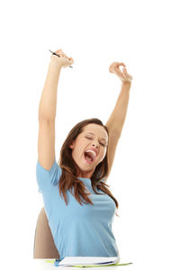 Smiling young woman against white background