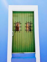 Close-up of window against blue sky