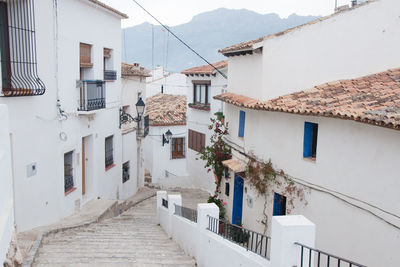 Beautiful street at altea with white houses, blue doors and windows and no