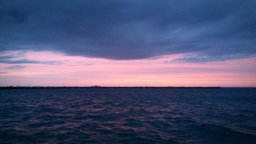 Scenic view of sea against sky at sunset