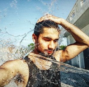 Portrait of young man in water