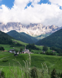 Scenic view of landscape and mountains against sky