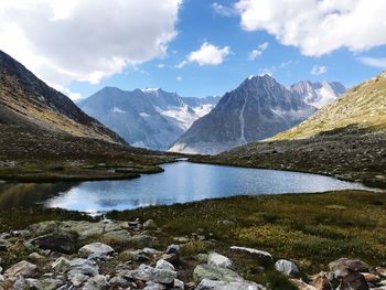 Scenic view of lake and mountains against sky