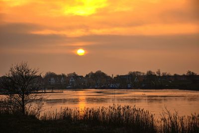 Scenic view of lake during sunset