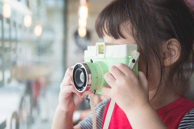 Close-up of girl photographing