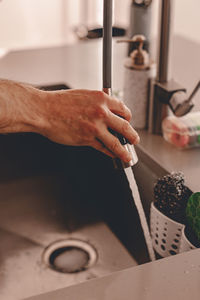 High angle view of man working in kitchen