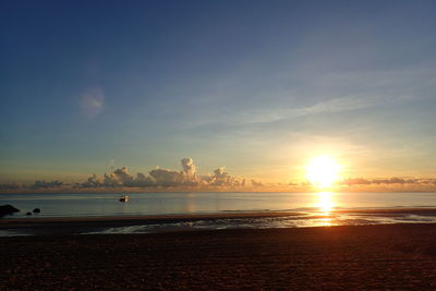 Scenic view of beach against sky during sunset