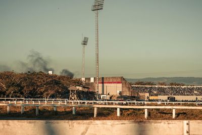 Built structure and flood lights against sky