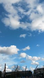 Low angle view of built structure against cloudy sky