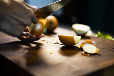 Cropped image of man preparing food on table