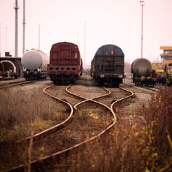 Train on railroad track against clear sky