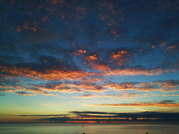 Scenic view of sea against sky at sunset