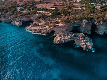 High angle view of rock formation in sea