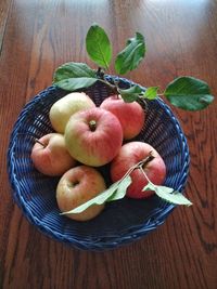 High angle view of apples in basket on table