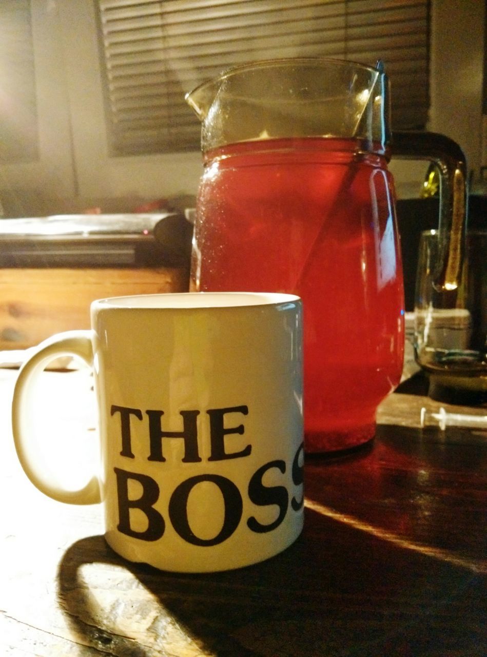 indoors, table, text, still life, food and drink, drink, close-up, western script, communication, focus on foreground, refreshment, coffee cup, no people, glass - material, container, restaurant, cafe, day, home interior, drinking glass