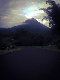 Scenic view of mountains against cloudy sky