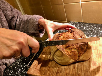 Midsection of man preparing food on table at home