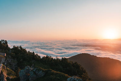 Scenic view of mountains against sky during sunset