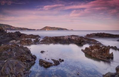 Scenic view of sea against dramatic sky