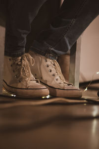 Low section of man wearing shoes on floor