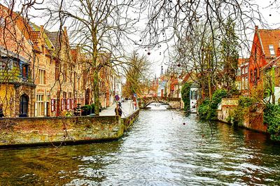 Canal amidst buildings in city