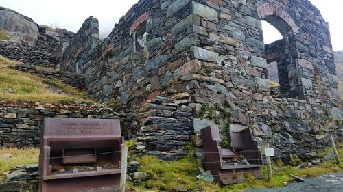 Built structure on mountain against sky