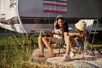 Girls relaxing on sun loungers