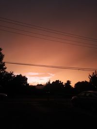 Silhouette trees against sky during sunset