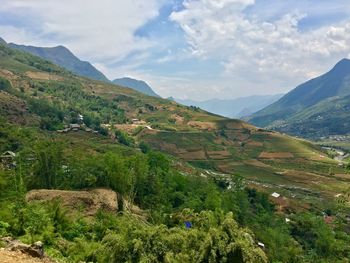 Scenic view of landscape and mountains against sky