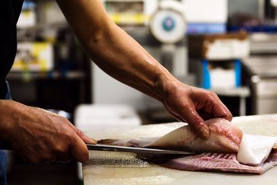 Close-up of man preparing food