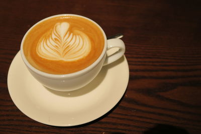 Close-up of cappuccino on table