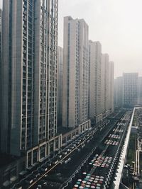 High angle view of railroad tracks amidst buildings in city