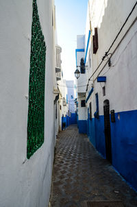 Narrow alley amidst buildings in city