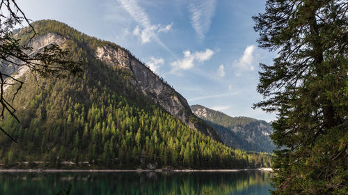 Scenic view of lake and mountains against sky