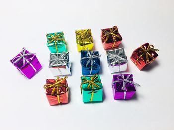 High angle view of multi colored pencils on white background