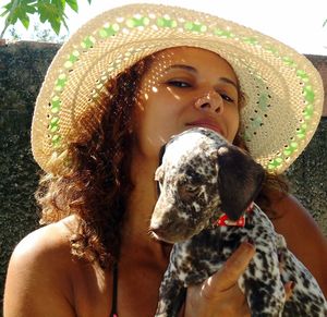 Portrait of young woman wearing hat
