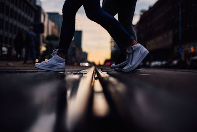 Low section of people walking on street city