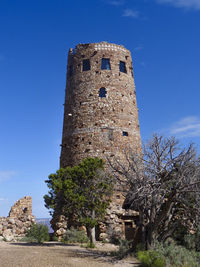 Low angle view of historical building against blue sky