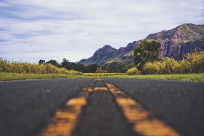 Road amidst landscape against sky