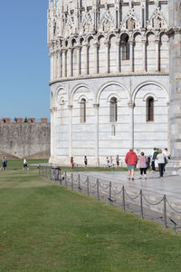 Group of people in front of historic building