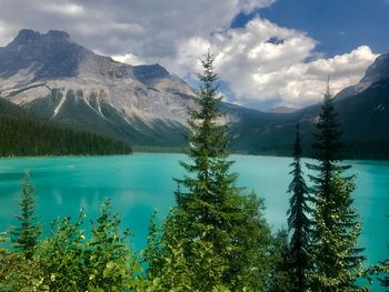 Scenic view of lake and mountains against sky