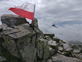 Low angle view of flag against sky