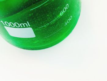 High angle view of green chili over white background