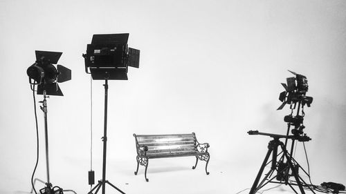 Bench with photographic equipment against white background